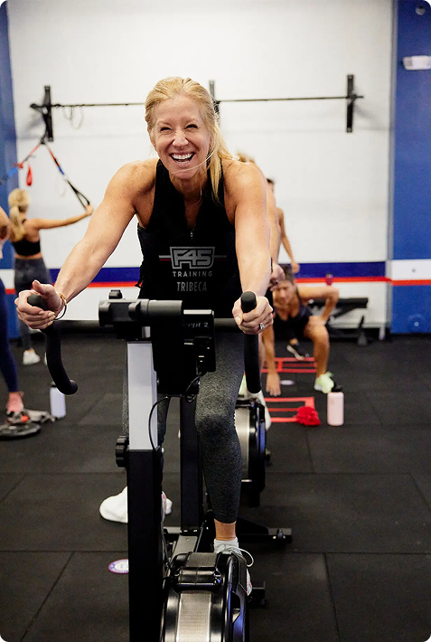 Fitness studio member enjoying branded merch in action